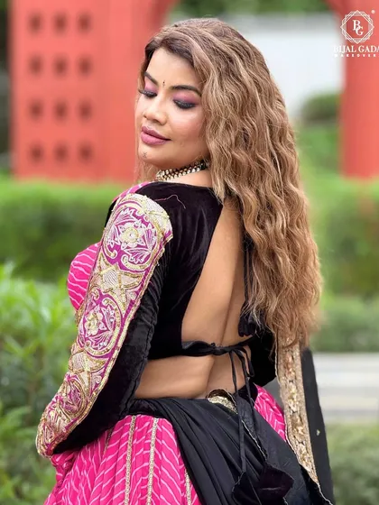 A back view of my traditional Navratri look, showcasing the intricate embroidery on the blouse and the flow of the lehenga.