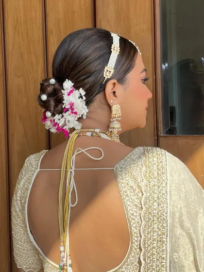 A side view of the pearl and hydrangea bun, showing the beautiful combination of textures and colors.