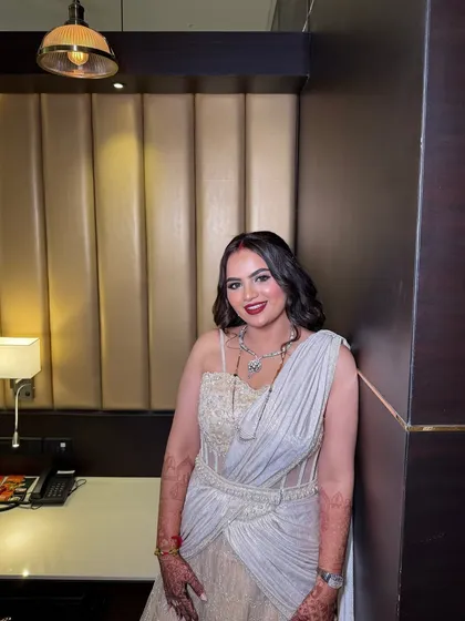 My beautiful bride Chandni, radiating grace in pastels for her reception. We created a dewy, glowing look with a pop of red on the lips for a touch of classic bridal elegance.
