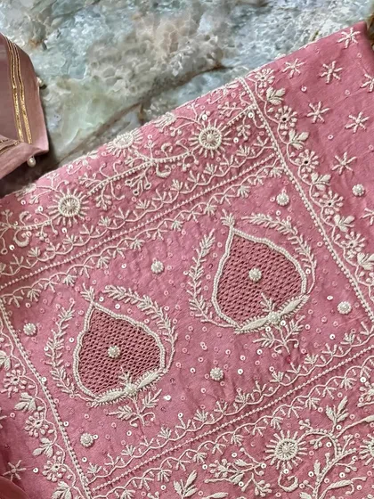 A close-up of the upper portion of the kurta, detailing the intricate jaal work.