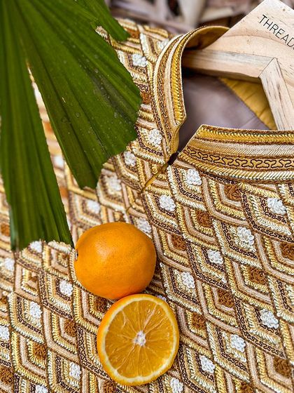 From waste to wardrobe. This intricately embroidered garment is made from orange peel fabric, a beautiful and unique addition to any wardrobe that is also eco-friendly.