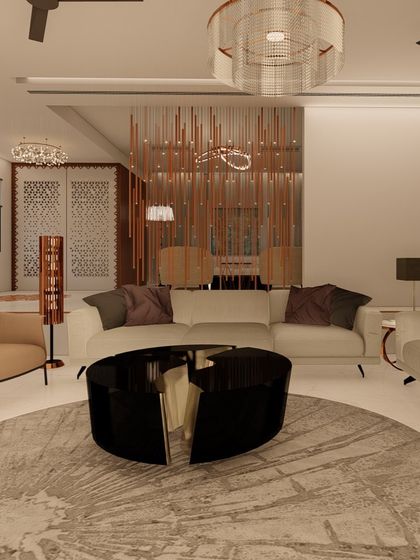 This living room design is centered around a circular rug and a unique black coffee table. The neutral sofas are accented with purple cushions, and a floor-to-ceiling copper-toned partition adds texture and visual interest.
