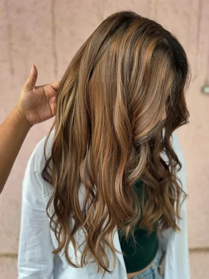 This mochaccino mane is on fleek. A perfect non-bleach color for a bride-to-be, giving her a soft, romantic look with beautiful light brown and caramel tones.