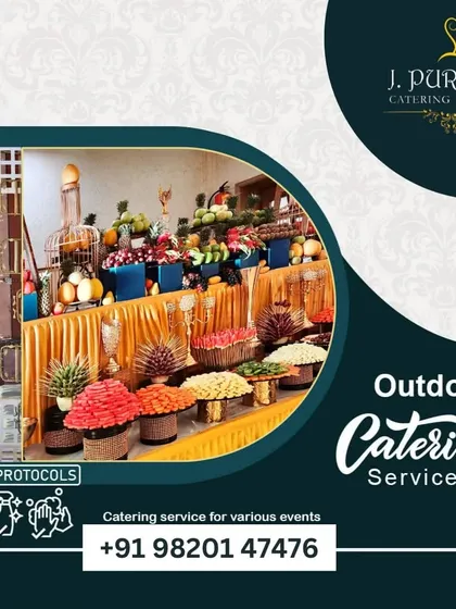 I specialize in outdoor catering, creating beautiful buffet displays like this fruit and salad bar. I ensure all safety and hygiene protocols are followed, even in an open-air setting.