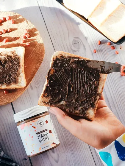 This is how you make a product irresistible. For this peanut butter brand, I created a bright, sunlit scene that feels like a happy morning. Showing the product being used, with a creamy spread on toast, helps customers imagine it in their own homes.