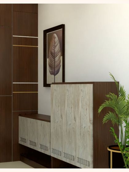 This is a 3D render we created for an entrance foyer, featuring a custom shoe rack with a mix of dark wood and lighter finishes. We also proposed handle-less shutters for a sleek, modern look that combines function with sophisticated style.
