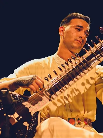 A performance shot from my London recital, with henna tattoos visible on my hands.
