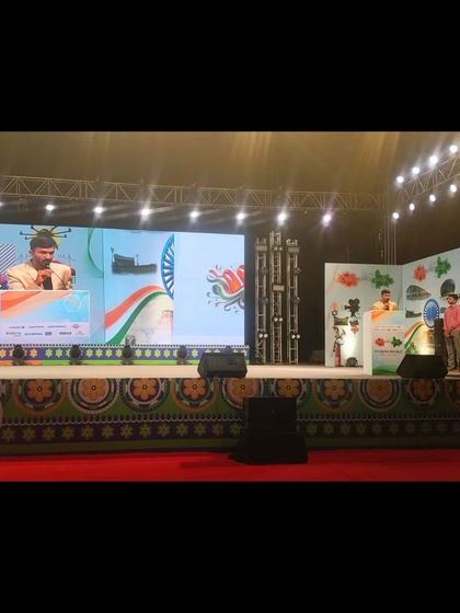 On the grand stage for the Anand Group event in Pune. The large LED screen ensures everyone in the 2000+ audience has a clear view of the sand art.