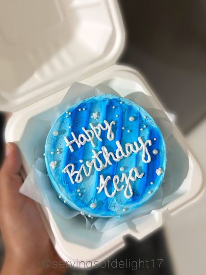 A blue-themed birthday bento cake with a watercolor buttercream effect. I can create these in any color palette you like.