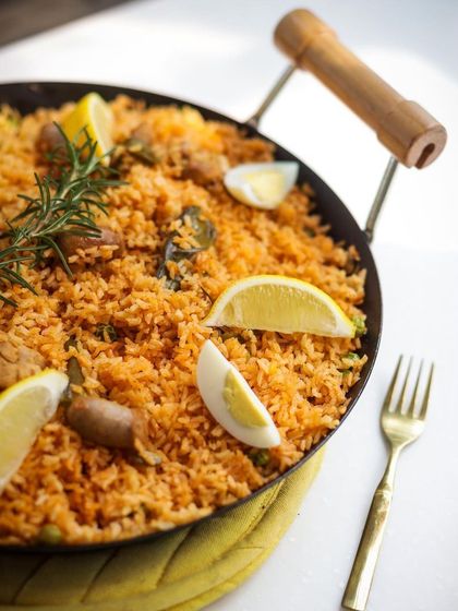 Another look at our hearty paella, brimming with chicken, sausage, and saffron-infused rice. A perfect dish for a group celebration.