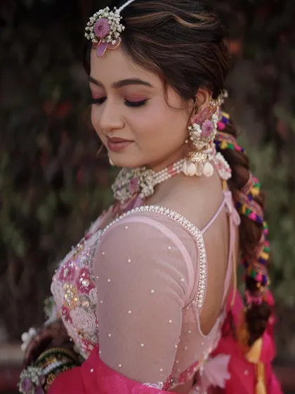 A closer look at a hybrid resin and fresh flower set we created for a Mehendi look. The braided hairstyle is beautifully decorated with matching floral accessories.