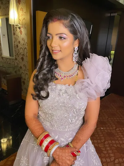 Slaying in lilac. This bride looks like a princess in her reception gown.
