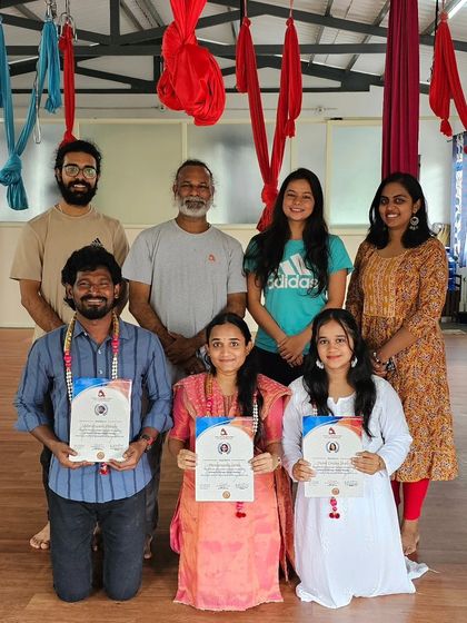 The graduating group of our Aerial Yoga TTC, celebrating their success together.