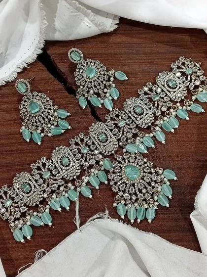 The pastel blue Victorian choker set is a wonderful option for those who prefer subtle elegance. The color is refreshing and the design is intricately detailed.
