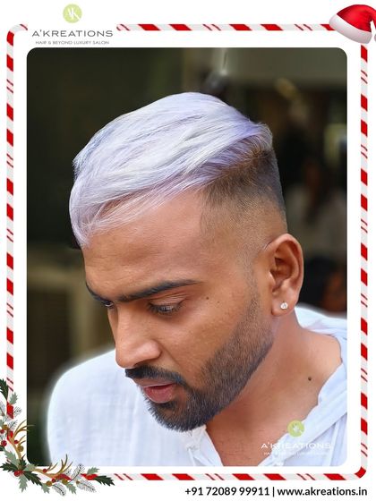 A striking platinum-white color paired with a perfect skin fade. This high-contrast look is clean, confident, and expertly executed.