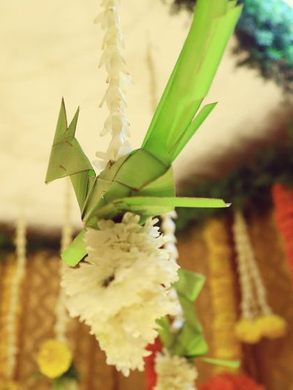 We believe in the magic of handcrafted details. This charming parrot, skillfully woven from coconut leaves, was a small but significant part of our traditional decor, showcasing our love for artisanal touches.