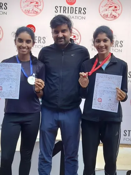 My athletes on the podium at a Striders Foundation event, securing silver and bronze.