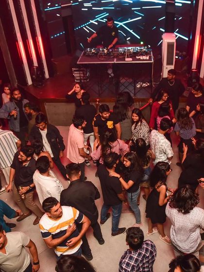 An overhead view of the dance floor, showing the movement and energy of the crowd.