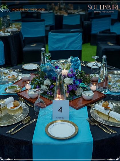 An elegant tablescape at the India Energy Week, featuring our signature blue and gold theme. We design sophisticated dining environments for major international conferences and summits.