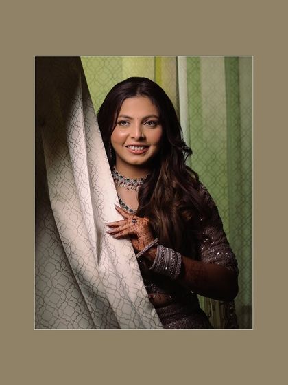 A classic bridal portrait, where the bride peeks out from behind a curtain, creating a soft and gentle look.