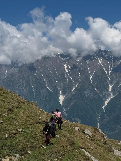 The trail to Bhrigu Lake offers stunning views of the surrounding snow-capped mountains.