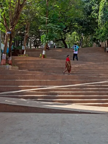 The clean, wide expanse of the amphitheater-style steps, designed for both passage and rest. The integrated ramp seen here is a key feature of our commitment to universal design in public spaces.