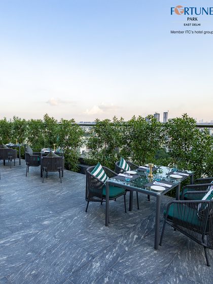 The city skyline peeks through the greenery, offering a constant reminder of our unique urban oasis setting.