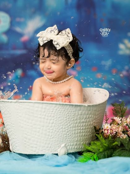 Even mermaids get emotional sometimes! A candid moment of a little one splashing in her underwater-themed bath.