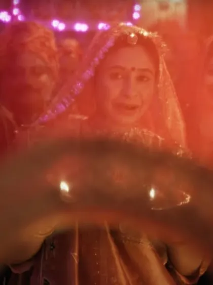 The bride's entry scene, where her traditional red lehenga and jewelry, which I styled, are central to the emotional moment.