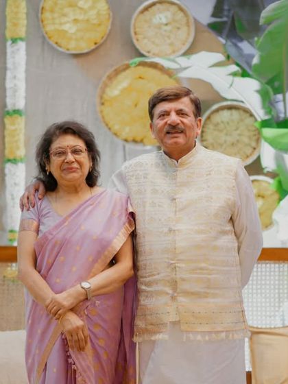 The proud grandparents celebrating their grandchild's Annaprashan. Our serene and traditional decor is designed to be appreciated by all generations.