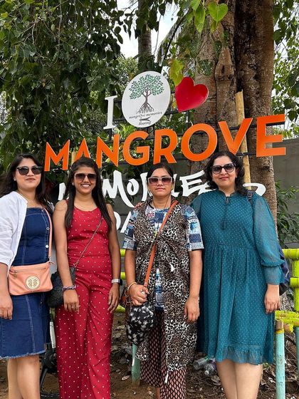 A group of women travelers at the Mangrove Memories park in Kerala.