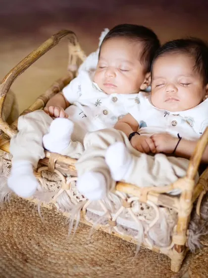 Two precious hearts sleeping side by side. This newborn twins photoshoot captures the special bond between siblings from their very first days.