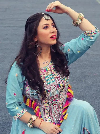 A creative pose showing off the traditional jewelry and hairstyle for my Navratri look.