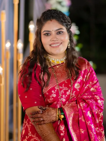 A happy portrait of the bride. Her skin is radiant and her makeup is perfectly balanced for an evening of celebration.