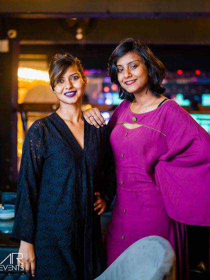 Two friends posing for a photo.