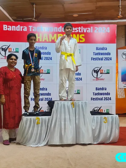 Raiyan takes the top spot on the podium, winning a gold medal at the Bandra Taekwondo Festival 2024. His focus and training paid off.