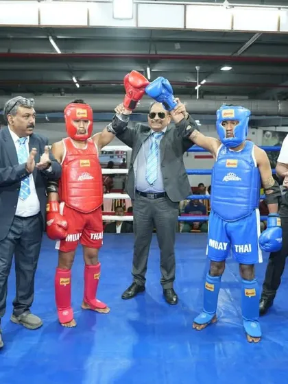 The referee raises the winner's hand at the 4th National Muay Thai Championship. A proud moment for our fighter and our academy.