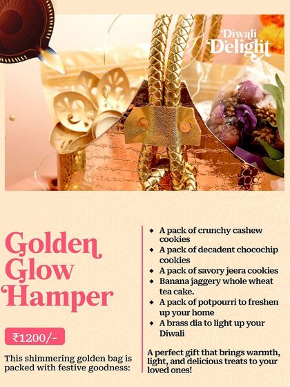 The "Golden Glow Hamper" for Diwali, a shimmering golden bag packed with assorted cookies, a whole wheat tea cake, and a brass diya.