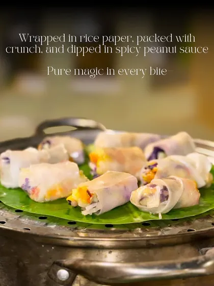 My Thai Summer Rolls are a refreshing and healthy appetizer choice. These rice paper rolls are packed with crunchy vegetables and served on a banana leaf, ready to be dipped in a spicy peanut sauce.