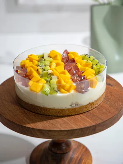 A closer look at our Old Fashioned Lemon Cream Pie, topped with fresh mangoes and other seasonal fruits.