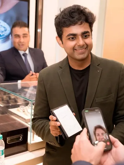 A guest captures a moment of magic on his phone at the Timevallee launch. In the age of social media, creating shareable moments is a valuable part of any brand event.
