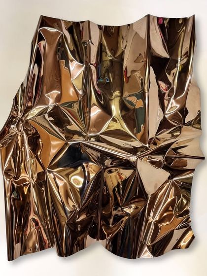 The full view of the bronze-gold Meteor sculpture, measuring 38" x 35". Its warm, reflective surface creates a sense of luxury and movement.