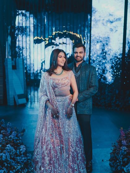 A beautiful portrait of the couple at their 'Interstellar' Sangeet, with the immersive blue lighting creating a romantic and futuristic mood.