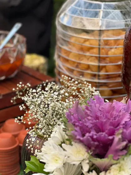 A close-up of our pani puri station, complete with a glass dispenser of puris and bowls of flavorful chutneys and fillings.