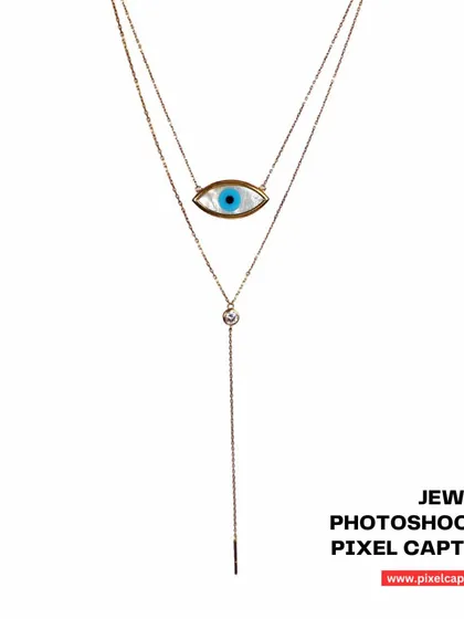 A layered evil eye necklace, shot on a white background to highlight its delicate design.