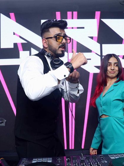 On stage with DJ Harsh Sharma for a New Year's party at Hotel Harmony Inn. We made sure the countdown was unforgettable.