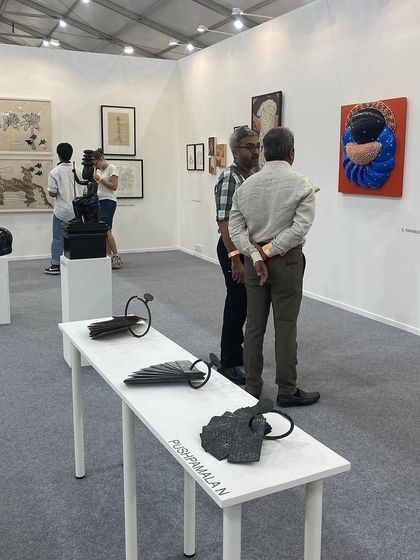 Visitors discussing the works on display at Art Mumbai.