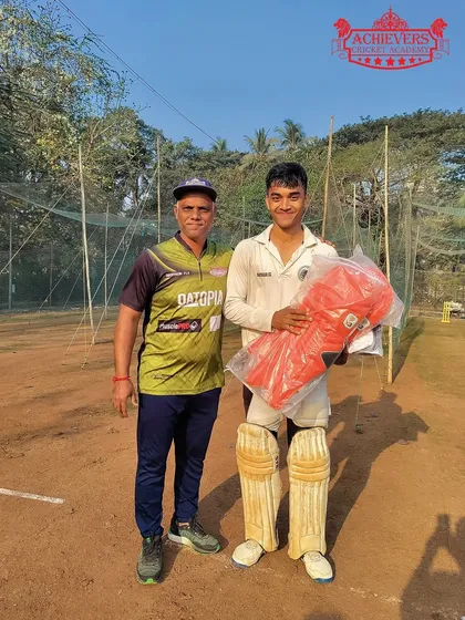 A player receiving new pads, thanks to the support of our sponsors. This support empowers our young talent.