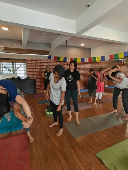 Laughter and focus go hand in hand during our workshops. These students are exploring a challenging but rewarding partner balance and stretch.