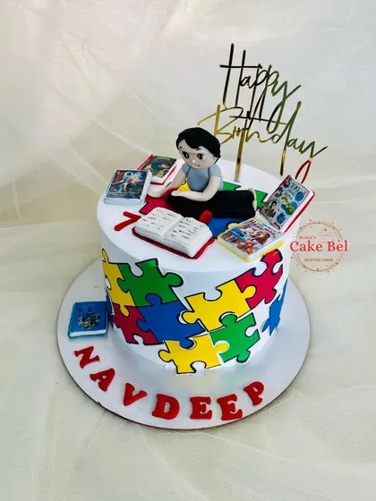 For a young boy who loves puzzles and mythological books. This cake combines both interests with a colorful puzzle pattern and tiny, readable fondant books.